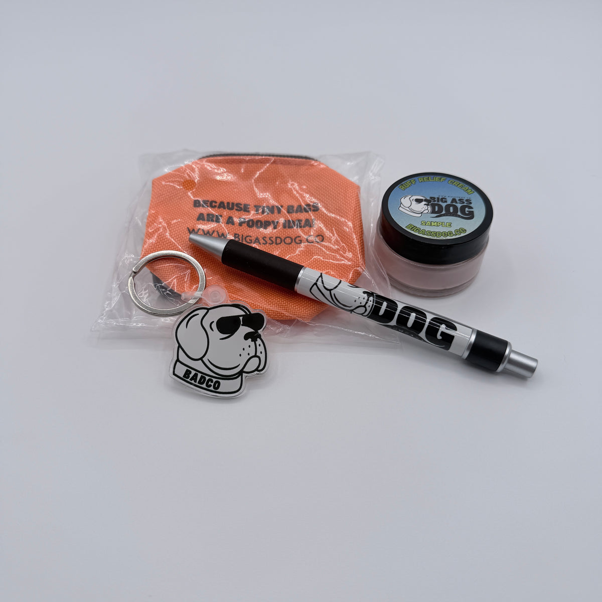 King of the Walk VIP Kit — Big Ass Dog Company pen, Ruff Relief Cream sample, poop bag dispenser, and keychain